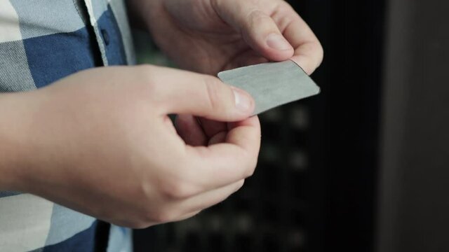 A man opens a package of anti-smoking plaster, close-up. Quitting smoking