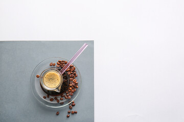 Turkish coffee in cezve and beans on light background