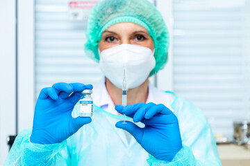 Doctor, woman nurse, scientist hand in white gloves holding bottle, syringe coronavirus, covid-19 vaccine disease preparing for a child, adult, man and woman vaccination shot medicine and drug concept