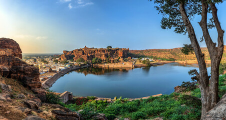 Fototapeta na wymiar Agasthya Lake and surrounding red rock hills. Badami, Karnataka, India.