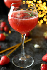 Concept of delicious drink with Rossini cocktail on background with blurred lights