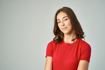 Fototapeta premium cheerful brunette in red t-shirt cropped view fashion teen