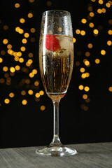 Concept of delicious drink with Rossini cocktail on background with blurred lights