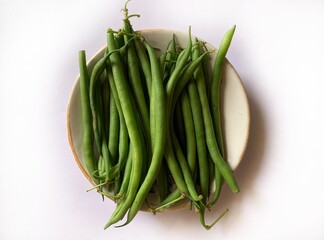 Delicious fresh green beans on white background