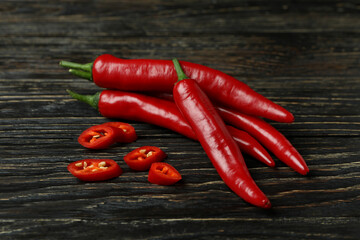 Red chili peppers on rustic wooden background