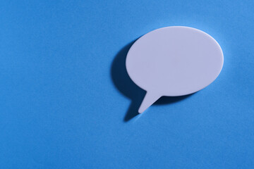blank speech buble on blue background