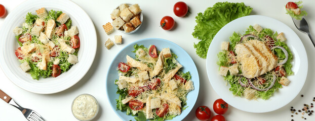 Concept of tasty eating with Caesar salad on white background