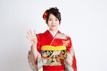 Fototapeta premium 振袖（着物）を着る若い日本人女性モデル