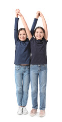 Obraz premium Cute twin girls on white background