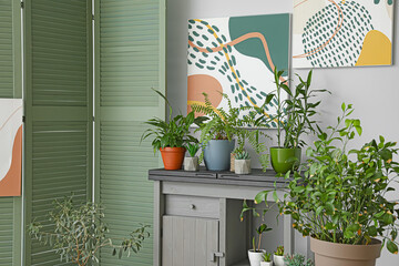 Interior of stylish room with folding screen