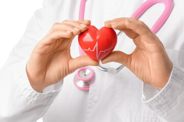 Female cardiologist with red heart on white background, closeup