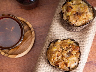 Banana muffin cakes with a cup of iced coffee