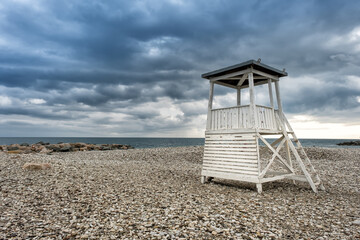 Lifeguard tower on the city beach in the morning before the rain in the resort village of Nebug, Krasnodar Territory, Russia.