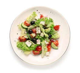 Plate with tasty Greek salad on white background