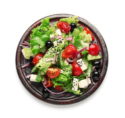 Plate with tasty Greek salad on white background