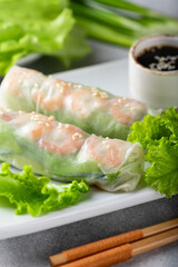 Spring rolls with shrimp, carrots, cucumber, green onions and rice noodles, selective focus