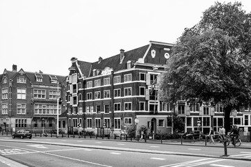 Fototapeta premium AMSTERDAM, NETHERLANDS. JUNE 06, 2021. Beautiful facades of the old dutch buildings.