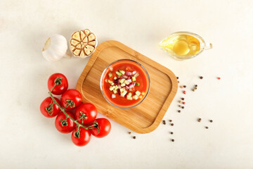 Composition with tasty gazpacho in glass on light background