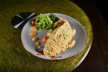 asian premium banquet menu seafood egg wok fried rice in fish shape on gold background dining table