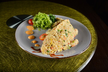 asian premium banquet menu seafood egg wok fried rice in fish shape on gold background dining table