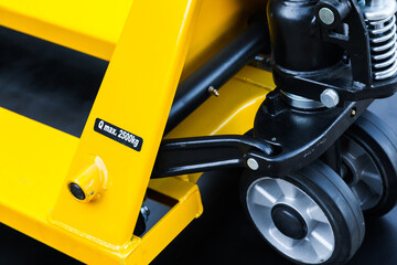 Wheelbarrow for transportation of pallets with cargo, close-up.