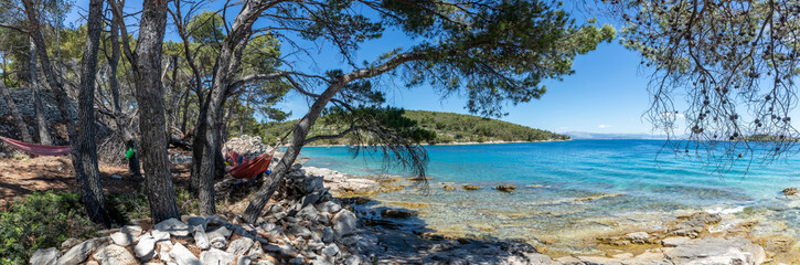 panoramic view of woman in hammock on the island Solta, Croatia