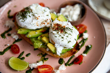 Whole wheat toasted bread with avocado and poached eggs
