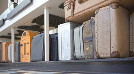 Old luggage and suit cases waiting to be checked in