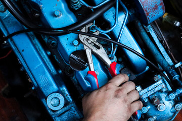 Motor (engine) service or maintenance work on the boat or yacht with oil and hand of the person for...
