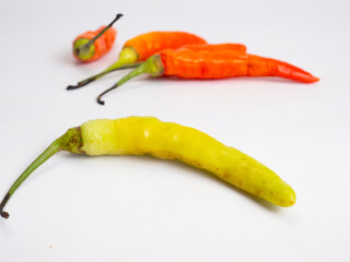 Close up shoot of red hot chillies on a white background