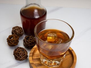 A cup of iced coffee on a wooden table