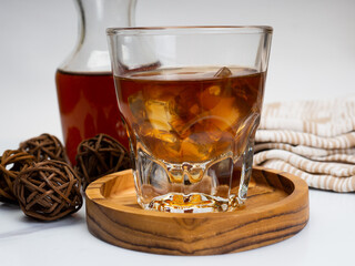 A cup of iced coffee on a wooden table
