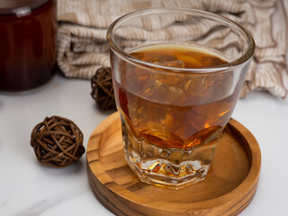 A cup of iced coffee on a wooden table