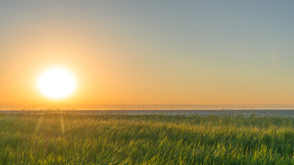 Sunset on the St Lawrence river near the small town of Cap Chat on the northern shore of the Gaspesie Peninsula in Quebec (Canada)