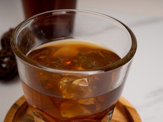 A cup of iced coffee on a wooden table