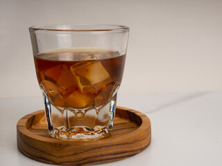 A cup of iced coffee on a wooden table