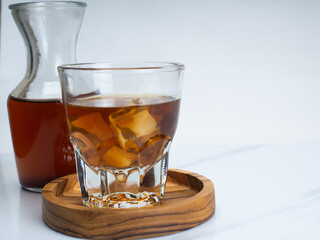 A cup of iced coffee on a wooden table