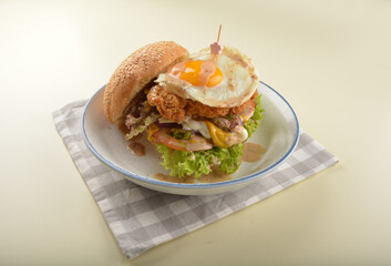 chef handmade giant deep fried crispy chicken with fried egg and vegetables cheesy burger in japanese sesame sauce restaurant western fast food cafe halal menu