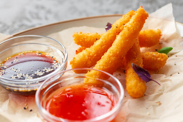 Deep fried shrimps served with sauce on plate