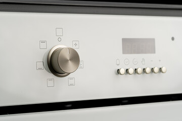 Modern oven mode control button close up