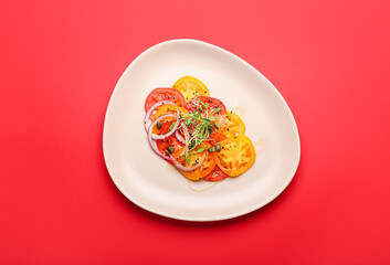 Plate with tasty tomato carpaccio on color background