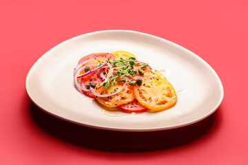 Plate with tasty tomato carpaccio on color background