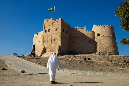 Middle Eastern Arab Emirati man exploring Fujairah Fort in the United Arab Emirates