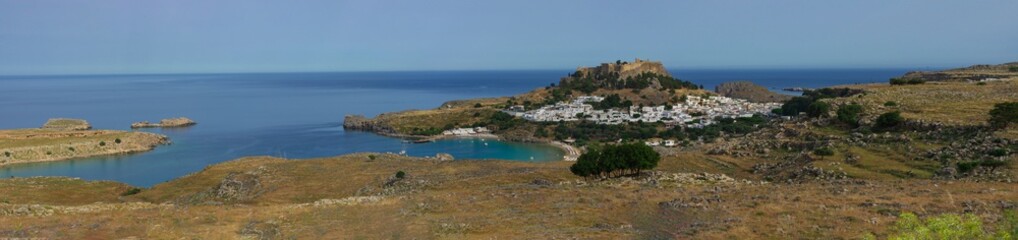 Beautiful panorama of the ancient city and acropolis of Lindos on the Mediterranean coast (Rhodes,...