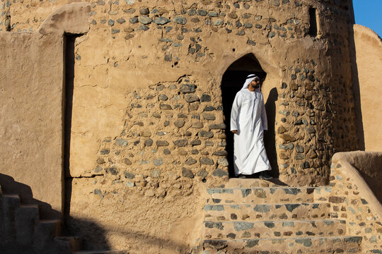 Middle Eastern Arab Emirati man exploring Fujairah Fort in the United Arab Emirates