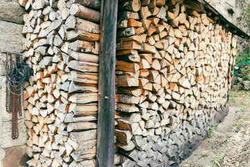Dry wood planks prepared for firewood and stored