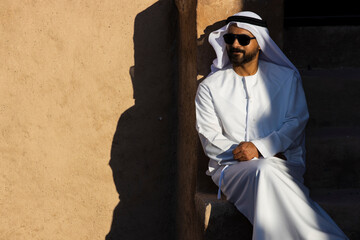 Middle Eastern Arab Emirati man exploring Fujairah Fort in the United Arab Emirates
