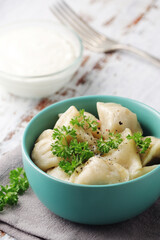 Russian national dish pelmeni served in a plate