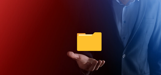 Businessman hold folder icon.Document Management System or DMS setup by IT consultant with modern computer are searching managing information and corporate files.Business processing