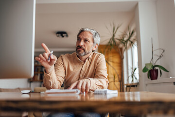 Adult man, asking a question in a conference call.